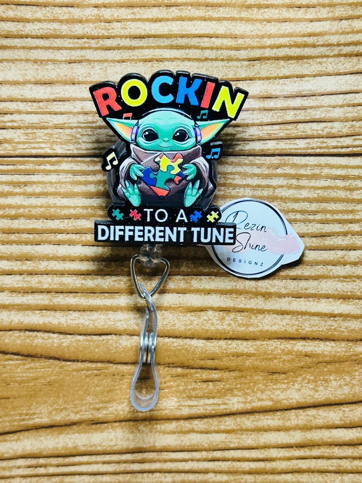 Rockin To A Different Tune Autism Badge Reel