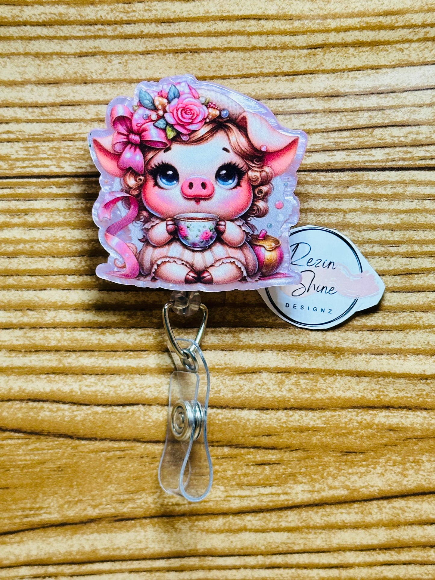 Pig with Tea Badge Reel