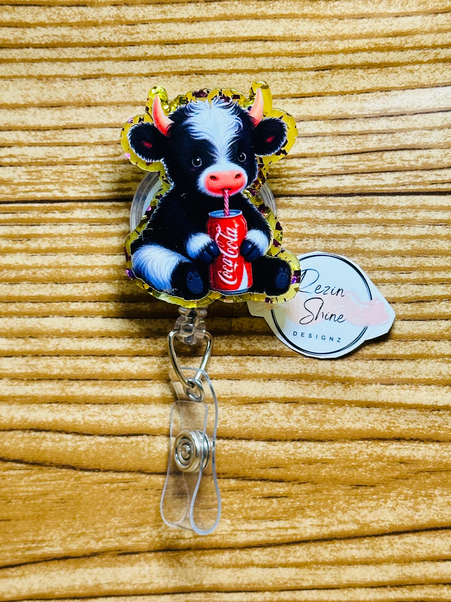 Cow With Cola Badge Reel