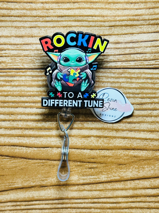 Rockin To A Different Tune Autism Badge Reel