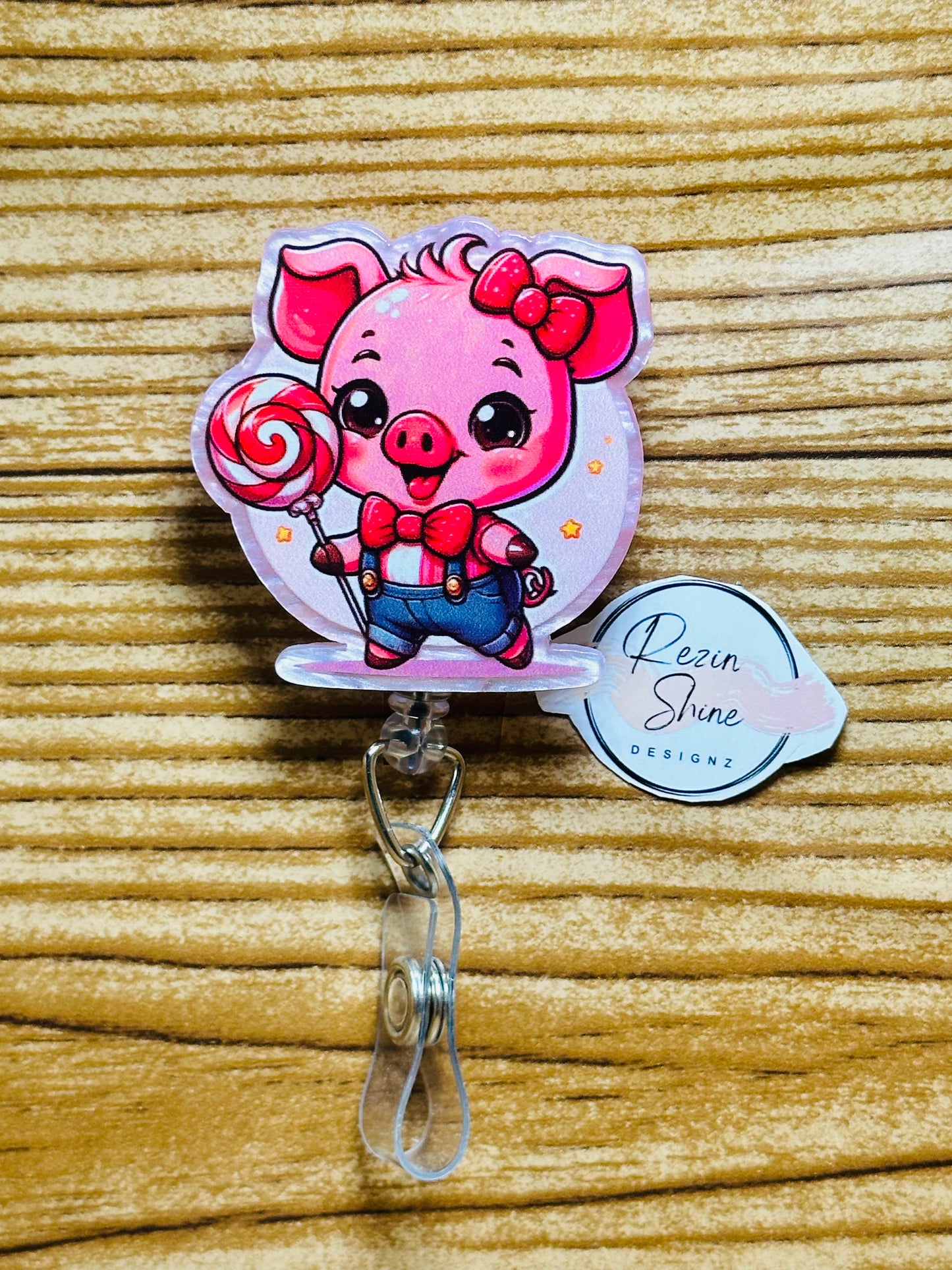 Pig with Lollipop Badge Reel